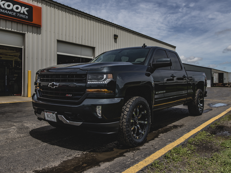 2017 Chevy Silverado 1500 With 2 Inch Rough Country Leveling Kit Rolling Big Power 94r 20x9 +0 Offset 20 By 9 Inch Wide Wheel Nitto Terra Grappler G2 285 55r20 Tire 