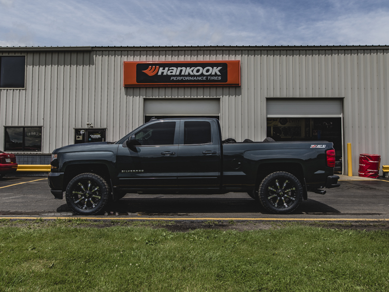 2017 Chevy Silverado 1500 With 2 Inch Rough Country Leveling Kit Rolling Big Power 94r 20x9 +0 Offset 20 By 9 Inch Wide Wheel Nitto Terra Grappler G2 285 55r20 Tire 